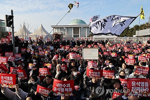 A mass rally is held in front of the National Assembly building in western Seoul on Dec. 7, 2024, as the National Assembly is set to vote on an impeachment motion against President Yoon Suk Yeol. (Yonhap)